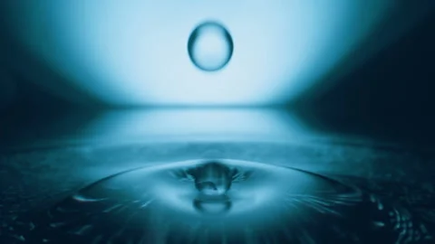 Super slow motion of dripping water drop filmed with macro lens Stock Footage 330112699