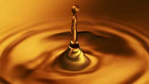 Super Slow Motion of Dropping Dark Golden Coffee or Whiskey Liquid. Stock Footage 304516109
