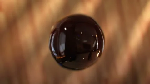 Super slow motion drops of coffee are falling into Cup Stock Footage 121091835