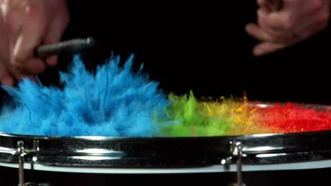 Super slow motion of  drummer banging on drums with colored powder explosion Stock Footage 142154781