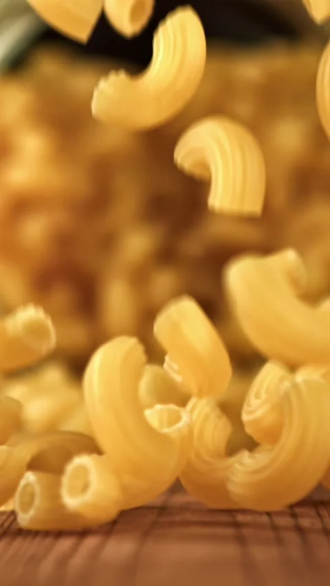 Super slow motion dry macaroni pasta . Filmed on a high-speed camera at 1000 fps Stock Footage 335368241