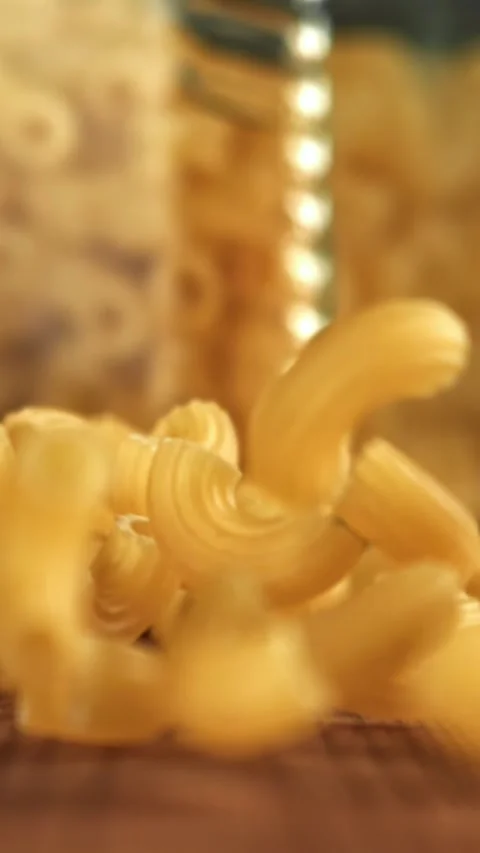 Super slow motion dry macaroni pasta . Filmed on a high-speed camera at 1000 fps Stock Footage 335372020