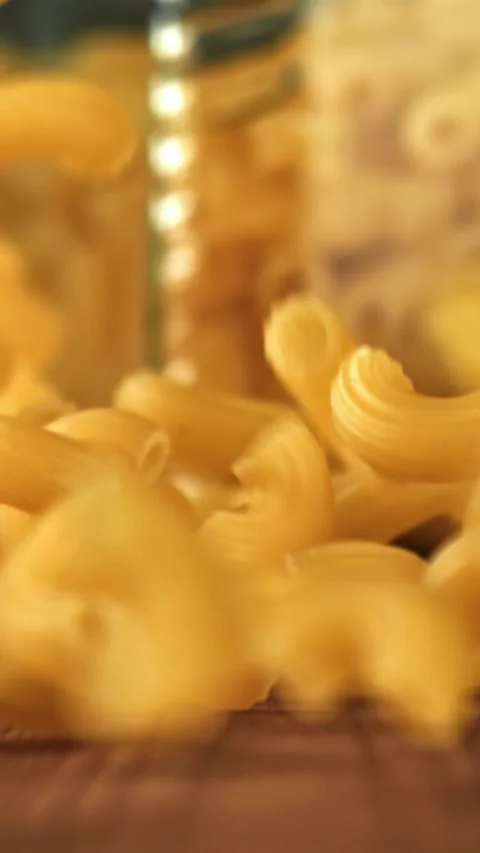 Super slow motion dry macaroni pasta . Filmed on a high-speed camera at 1000 fps Stock Footage 335376581