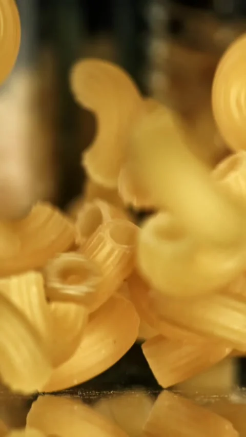 Super slow motion dry macaroni pasta . Filmed on a high-speed camera at 1000 fps Stock Footage 335377281