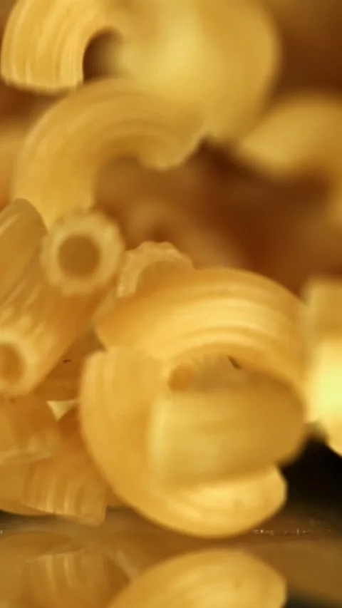 Super slow motion dry macaroni pasta . Filmed on a high-speed camera at 1000 fps Stock Footage 335378401