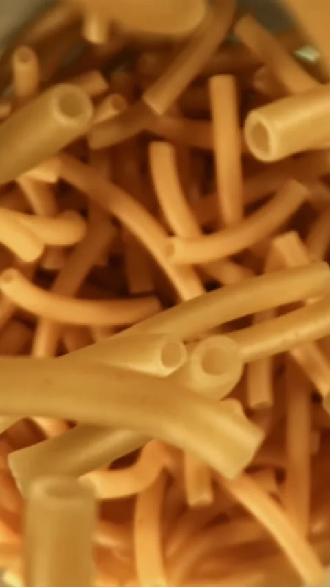 Super slow motion dry maccheroni pasta . Filmed on a high-speed camera at 1000 Stock Footage 335381518
