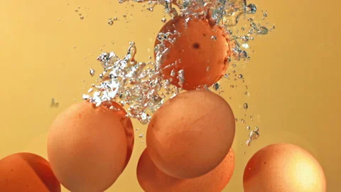 Super slow motion eggs fall under water with bubbles. Stock Footage 271340979