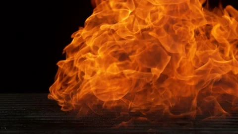 Super slow motion of empty grill grid with fire on black background Stock Footage 146007038