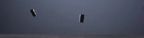 SUPER SLOW MOTION Empty pistol shells falling on a ground against blue bg Stock Footage 152615744