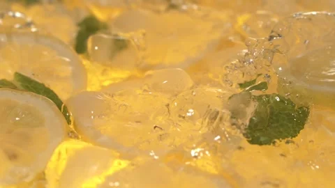 Super Slow Motion Enticing Image Showcasing Lemon And Mint Pieces With Sparkling Stock Footage 327096147