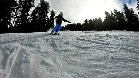 SUPER SLOW MOTION: Expert skier ski down the slope and spraying snow Stock Footage 94637003