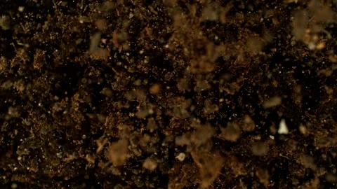 Super slow motion of exploding and rotating earth in the air. Stock Footage 245619327