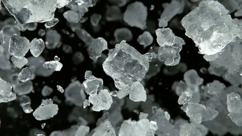 Super Slow Motion of exploding crushed ice towards camera Stockbeeldmateriaal 120376707