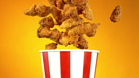 Super Slow Motion of Exploding Fried Chicken Pieces from Bucket. 動画素材 261971805
