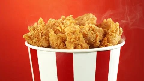 Super Slow Motion of Exploding Fried Chicken Pieces from Bucket. 動画素材 273578992