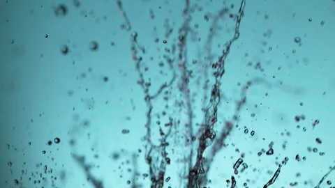 Super slow motion of exploding water splashes on soft blue background Stock Footage 118697430