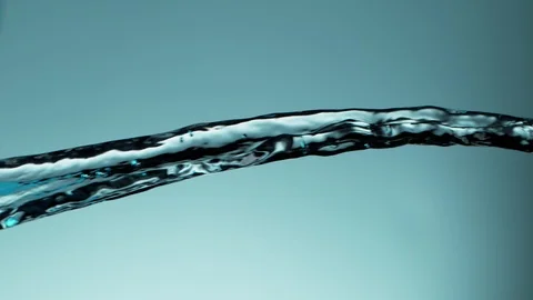 Super slow motion of exploding water splashes on soft blue background Stock Footage 122670256