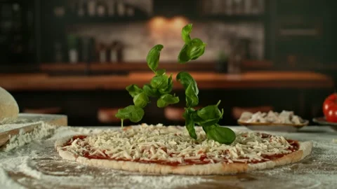 Super Slow Motion of Falling Basil Leaves on Pizza Dough. Stock Footage 301317884