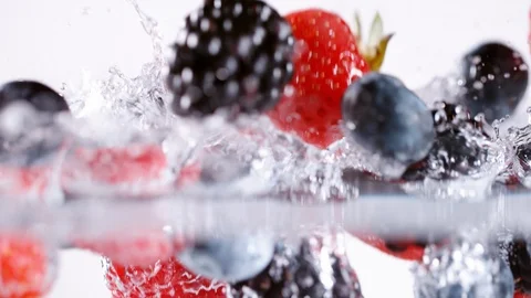 Super slow motion of falling berries into water, 1000 fps Stock Footage 90667797