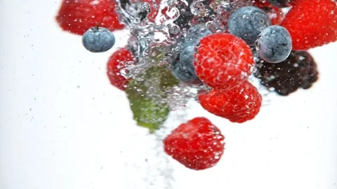 Super slow motion of falling berries underwater. Stock Footage 243011416