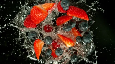 Super Slow Motion of Falling Berries Mix into Water Stock Footage 276105030