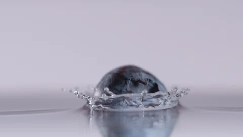 Super slow motion of falling blueberries into water, 1000 fps Stock Footage 90668083