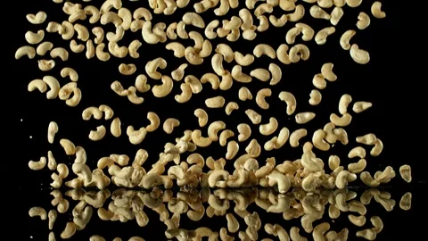 Super Slow Motion of Falling Cashews Nuts with Reflection Stock Footage 251795184