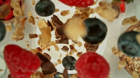 Super Slow Motion of Falling Cereals into Milk. Stock Footage 274190918