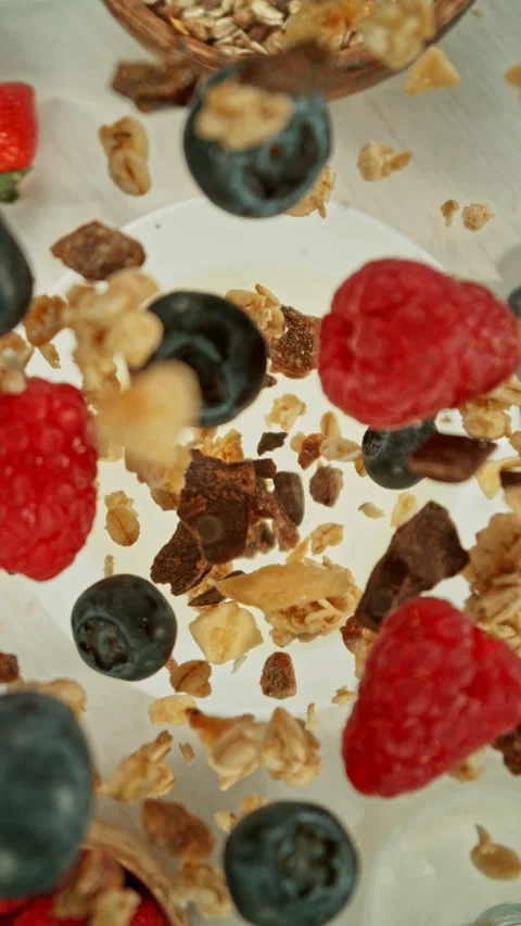 Super Slow Motion of Falling Cereals into Milk. Stock Footage 298860191