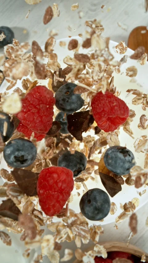 Super Slow Motion of Falling Cereals into Milk. Stock Footage 309096515