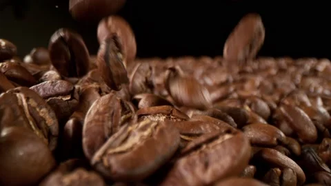 Super slow motion of falling coffee beans with camera move Stock Footage 152453115