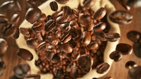 Super Slow Motion of Falling Coffee Beans, Rotating. Stock Footage 281558868