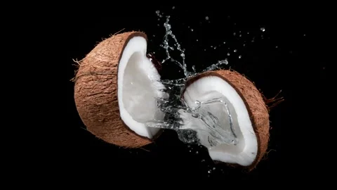 Super slow motion of falling cracked coconuts Video stock 249325989