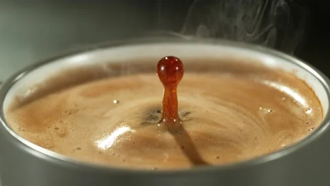 Super slow motion of falling drop into coffee with camera motion Stock Footage 235330739