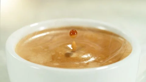 Super slow motion of falling drop into coffee. Stock Footage 235527081