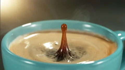 Super slow motion of falling drop into coffee. Stock Footage 235527146