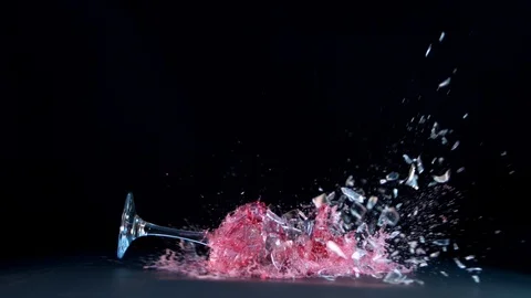 Super slow motion of falling glass of red wine, isolated on black background Stock Footage 94795629