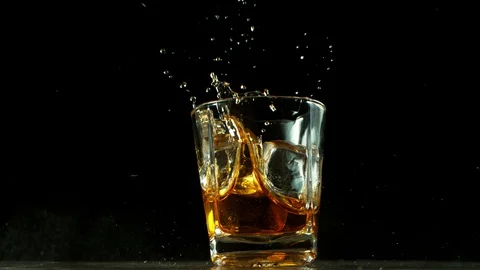 Super slow motion of falling glass of whiskey, being destructed Stock Footage 127960208