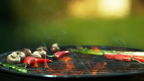 Super slow motion of falling hamburger steaks on grill. Stock Footage 106474437
