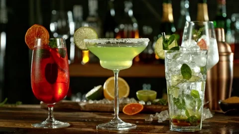 Super slow motion of falling ice cube into margarita with speed motion Stock Footage 231984793