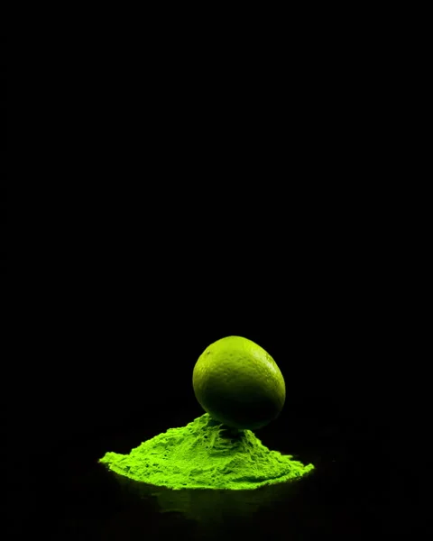 Super slow motion of a falling lime in holi colors, or in colored powder. Stock Footage 236275942