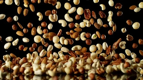 Super Slow Motion of Falling Mix Nuts with Reflection Stock Footage 251795449