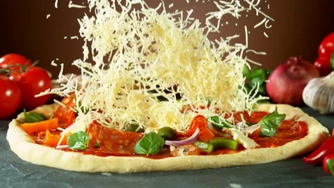 Super slow motion of falling mozzarella cheese on pizza dough. Video stock 132005652