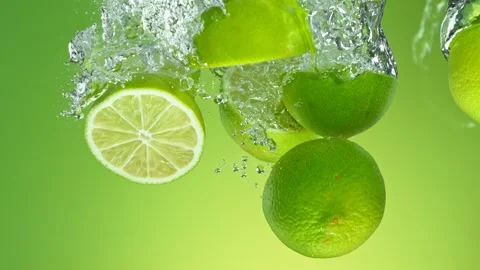 Super Slow Motion of Falling Pile of Limes Into Water. Stock Footage 253390087