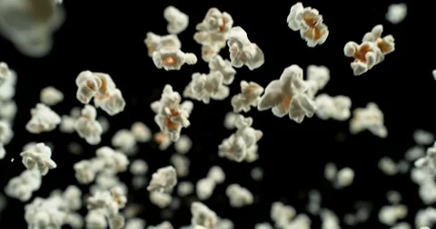 Super Slow Motion of Falling Popcorn, Wide Angle Shot. Stock Footage 323074236