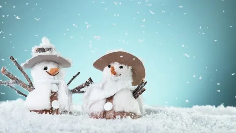 Super slow motion of falling snow with two christmas snowmen Stock Footage 163094020