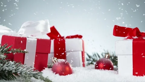 Super slow motion of falling snow with christmas gifts still life. Stock Footage 221925687