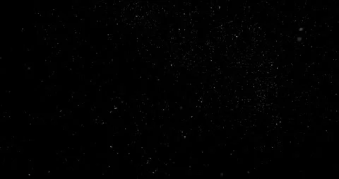 Super slow motion falling snow or dust particles isolated on a black background. Stock Footage 335284169