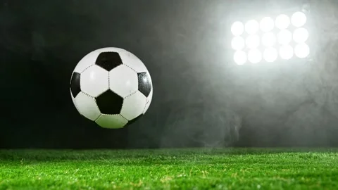 Super slow motion of falling soccer ball on lawn. Stock Footage 175302040