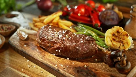 Super Slow Motion of Falling Spice on Beef Steak. Stock Footage 266993937